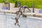 Boys jumping into the river, Singapore. Statue