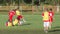 Boys kicking football