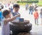 Boys lighting an incense stick