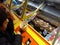 Boys play a penny falls game in an amusement arcade