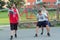 Boys are playing basketball on court in local settlement in Slovakia