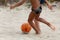 Boys playing beach soccer