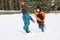 Boys Playing outside in Snow