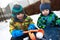 Boys playing with snowball maker