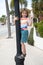 Boys plays. Happy boy stand on lamppost. Boy child smile showing V sign. Happiness and joy