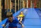 Boys riding slide inside playground