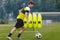 Boys Running Soccer Ball on Training Venue. Young Athlete Practicing Football on Grass Field