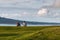 Boys sitting on grass watching clouds