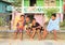 Boys sitting on railings in Labuan Bajo