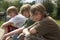 Boys Sitting On Street Curb