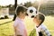 Boys in the summer park with a football ball