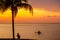 Boys at sunset on Caribbean island