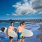 Boys surfers group coming out from beach