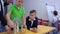 Boys and teacher explores wimshurst machine