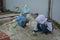 Boys of two and seven years old play in the sandbox.