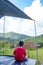 The boys Watch the mountains and skies in tent.