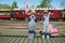 Boys waving American flags train departure