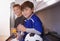 Boys will be boys. two young boys having cold drinks after soccer practice.