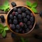 Boysenberry banner. Bowl full of boysenberries. Close-up food photography background