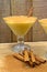 Boza and cinnamon sticks, traditional Turkish cuisine drinks, on wooden background