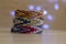 Bracelet of friendship, colorful woven friendship bracelets on wooden table