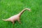 Brachiosaurus toy on grass