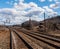 Braddock, Pennsylvania, USA March 19, 2022 Overhead railroad signals above train tracks in an industrial area