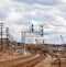 Braddock, Pennsylvania, USA March 19, 2022 Overhead railroad signals above train tracks in an industrial area