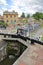 Bradford on Avon, UK - AUGUST 13, 2017: People enjoying a summer day at Canal Wharf with colorful barges on Kennet and Avon Canal