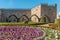 BRAGA, PORTUGAL - CIRCA FEBRUARY 2019: Santa Barbara garden with the medieval Episcopal Palace of Braga in background