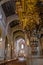 Braga, Portugal - December 28, 2017: Se de Braga Cathedral. Detail of wood carved and gilded baroque organ and nave, main chapel