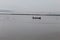 Brahmaputra river. A boat in the middle of the river