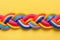 Braided ropes on color background, top view