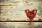 Braided wire heart on old wooden planks