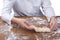 Braiding Challah dough baker on a table flour