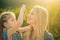 Braiding hair - Little daughter hugging her happy mother. Nice child girl with plaits. Hair in trendy weave plait.