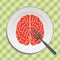 Brain food on plate with fork and knife -