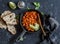 Braised beans in tomato sauce in a cast iron pan and homemade bread