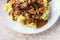 Braised beef, beef stroganoff with gravy on mashed potatoes. Close-up, top view