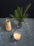 Braised milk in a glass mug and bottle on a dark background