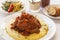 Braised veal on bed of polenta with vegetables