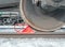 Brake shoe of rail wheel of train on the rail. Winter shoot.