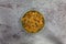 Bran flake cereal with raisins in a stoneware bowl