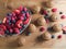 Bran muffins and berry fruit on wooden board