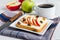 Bran toast with cheese, apple and dried fruit, bright breakfast