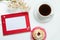 Branch of the blossoming chestnut, red frame for a congratulation inscription, lemon cake and a coffee cup