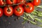 Branch of cherry ripe tomatoes, fresh rosemary, allspice, food photography