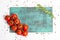 Branch of cherry ripe tomatoes, rosemary, allspice, wooden board