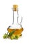 A branch of olive and olive oil in a decanter on a white backgro