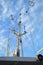 Branched antenna wire of the ship against blue sky